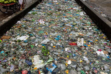 Bangladesh â October 19, 2021: The mouth of the canal is blocked by piles of plastic waste and food waste dumped in the city of Jatrabari, Dhaka.のeditorial素材