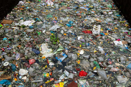 Bangladesh â October 19, 2021: The mouth of the canal is blocked by piles of plastic waste and food waste dumped in the city of Jatrabari, Dhaka.のeditorial素材