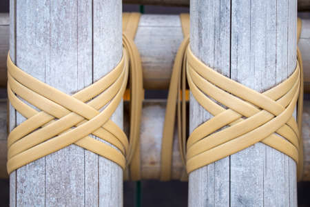 light color wood and yellow loop rope closeup backgroundの写真素材