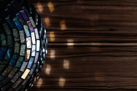 antique vase light reflection on brown wood tableの写真素材