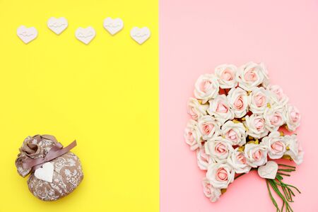 Pink and white roses, heart shape stones and gift wrapped on flat lay paper, happy mothers day celebrationの写真素材