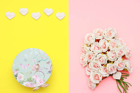 Pink and white roses, heart shape stones and gift wrapped on flat lay paper, happy mothers day celebrationの写真素材