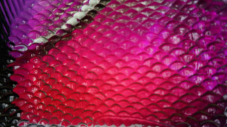 An abstract red color of fish scales