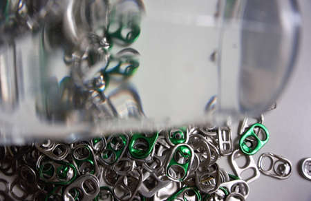 Abstract image of a beer and soft drink can opener depicts a garbage reuse.