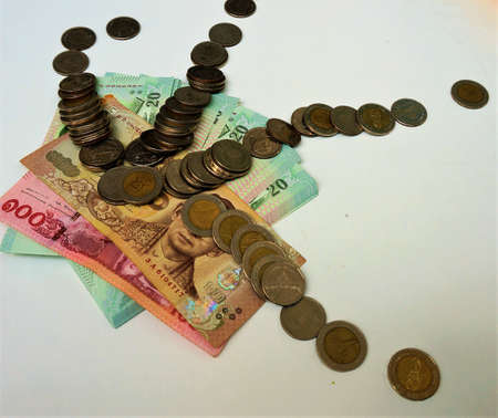 Thai's coins bank note with Business activity image.Business and Collecting money concept