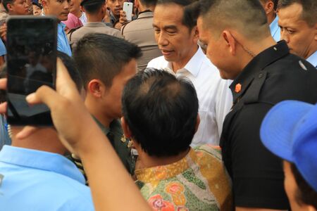 Pekalongan,Central Java/Indonesia - November â22th â2018 : Indonesian president Joko Widodo shopping for batikのeditorial素材