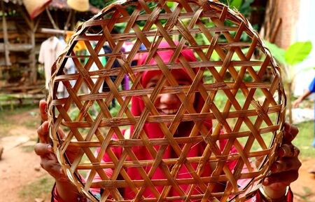 bamboo basket craftswoman while doing his work in a place, Batang / Jawa Tengah - Indonesia, May 26, 2019のeditorial素材