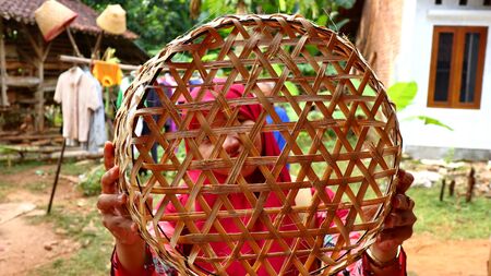 bamboo basket craftswoman while doing his work in a place, Batang / Jawa Tengah - Indonesia, May 26, 2019のeditorial素材