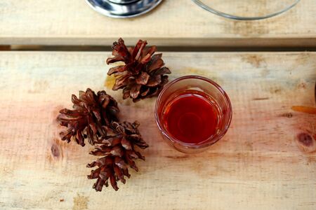 coffee drinks served on wooden tables, with added pine decorationsの写真素材