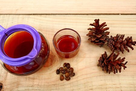 coffee drinks served on wooden tables, with added pine decorationsの写真素材