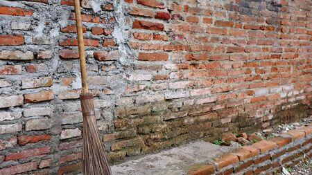 Selective focus sweep the stick with a background wall, blurry  objectの写真素材