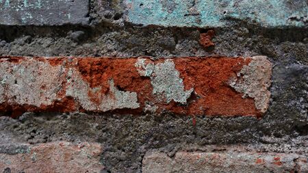 The brick walls are weathered dirty and full of dustの写真素材