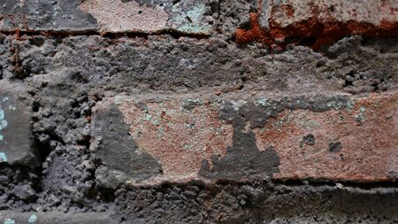 The brick walls are weathered dirty and full of dustの写真素材