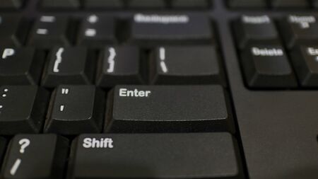 The ENTER key on the black keyboard, and various other keys to make typing easier