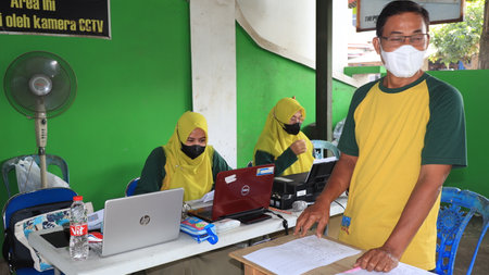 Civil Servant receiving the third covid vaccine, Batang, Indonesia, 14 February, 2022のeditorial素材