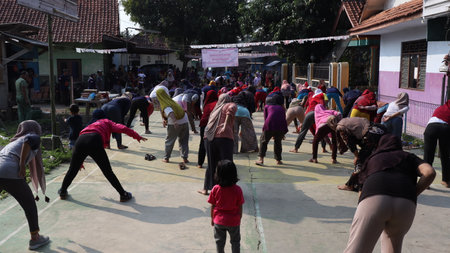 Villagers doing gymnastics together in the morning cheerfully, Batang Indonesia, August 17, 2022のeditorial素材