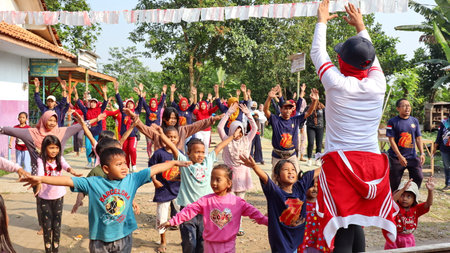 Villagers doing gymnastics together in the morning cheerfully, Batang Indonesia, August 17, 2022のeditorial素材
