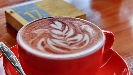 Red cup drink on wooden table.Drink in Restaurant Coffee Shop Concept