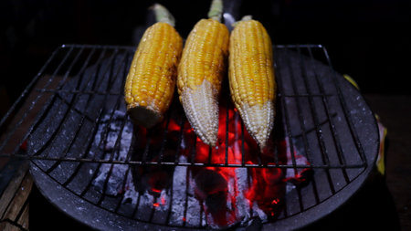 Delicious maize is being sold on the street. Roasted and baked maizes for sale. Grilled corns on the...