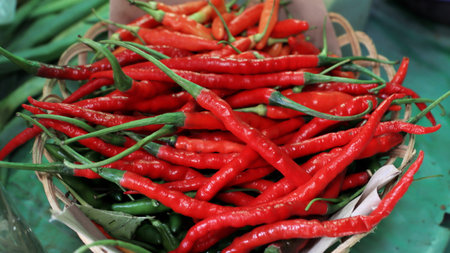 Fresh and organic red chili pepper. Hot chili pepper sale at basket. Close-Up Photo of Red Chili.