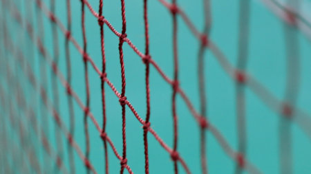 Tennis Net with blurry tennis court. Close Up of Tennis Court Net.の写真素材