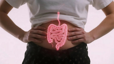 Man experiencing abdominal pain with digital overlay of digestive system highlighting the discomfort, symbolizing health issues and medical concerns.の素材