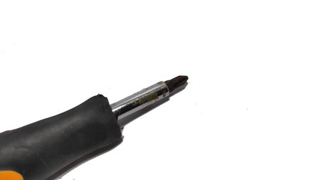 Black and red plastic handle screwdriver isolated on white background metal tool for home repair and...