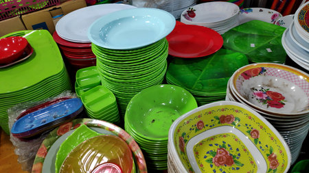 Cheap plastic household items for sale on the market close up Environment pollution concept