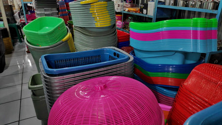 Cheap plastic household items for sale on the market close up Environment pollution conceptの写真素材