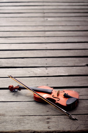 Violin on a wooden bridgeの写真素材