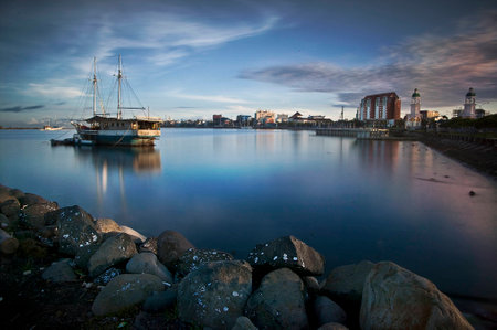 Old boat with cityscapeの写真素材
