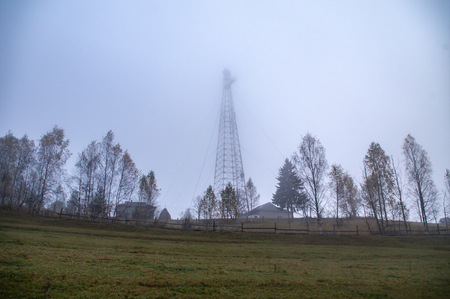 Telecommunication tower in the morning in the fogの写真素材