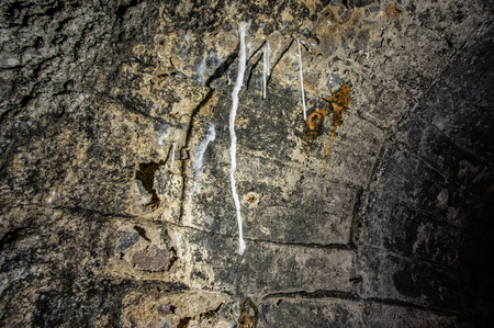 Long white stalactite in a salt mineの写真素材