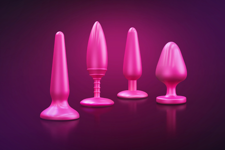 Different bdsm toys - dildo, prostate massager, vibrator, anal plug and others on a pink background. There is an empty space for your text. 3D illustration.の写真素材