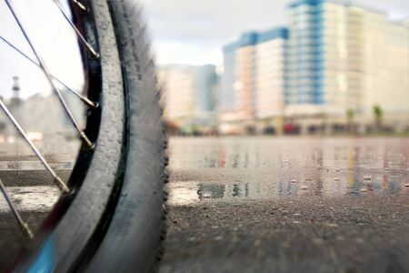 Bicycle wheel close-up. Bad weekend bad weather for cycling.