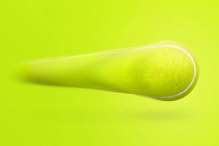 Tennis ball on yellow background. Flying ball.の写真素材