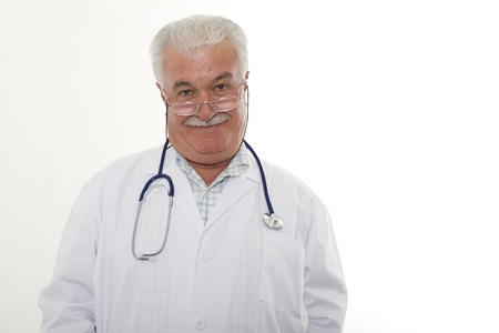 Experienced grey hair male doctor looking at the objective,の写真素材