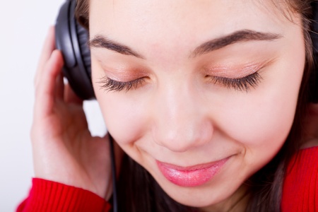 Young girl listening/feeling music her eyes shut. Perhaps classical.の写真素材