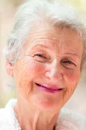 Grandmother is looking at you meaningfully with her white hair.の写真素材