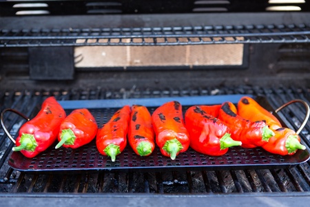 Roasting the chillies on the grillの写真素材
