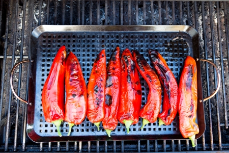 Eight pieces of grilled chili placed on a rectangular tray in the barbecue.の写真素材