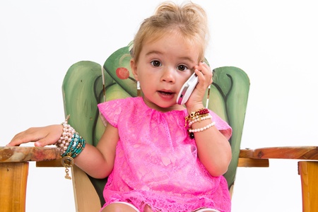I told you sweetheart I cannot make it and she hang up the cell phone in her lovely pink dressの写真素材