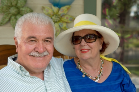 White Hair man and his wife in straw hat relaxedの写真素材