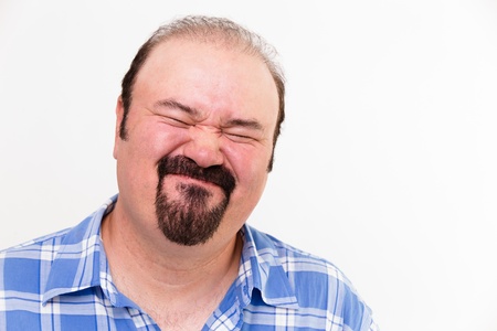 expressive face on a man isolated on whiteの写真素材