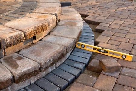 Pavers meets with patio steps and job completion almost done, last check with yellow levelの写真素材