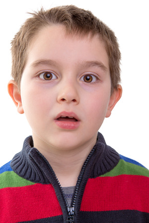 Shocked and amazed look from a eight years old kidの写真素材