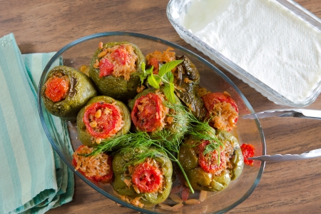 Turkish Stuffed green bell pepper dolma's ready to serve along with homemade yogurtの写真素材