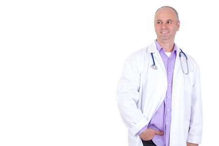 Middle age male practitioner doctor looking out anticipatory with a confident smile and relaxedの写真素材
