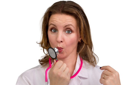 Female Doctor Looking in to your eyes questioning and blamingly perhaps asking do you have your ObamaCare insurance yetの写真素材