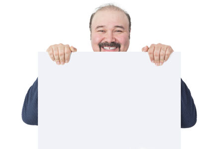 Smiling man holding a white boardの写真素材